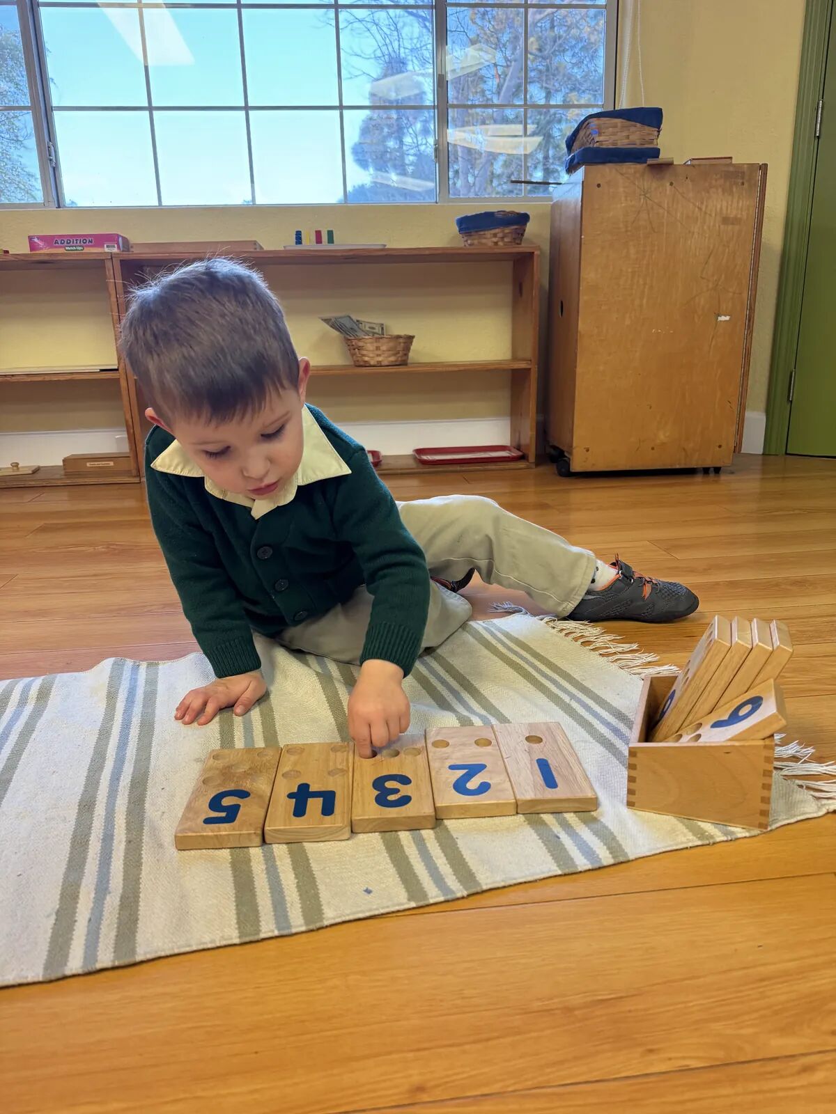 Counting with number tiles – Slater Montessori Academy