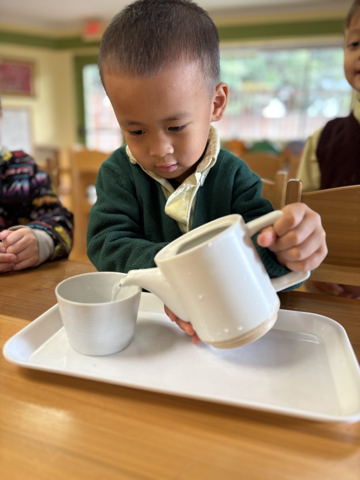 Pouring with care – Slater Montessori Academy